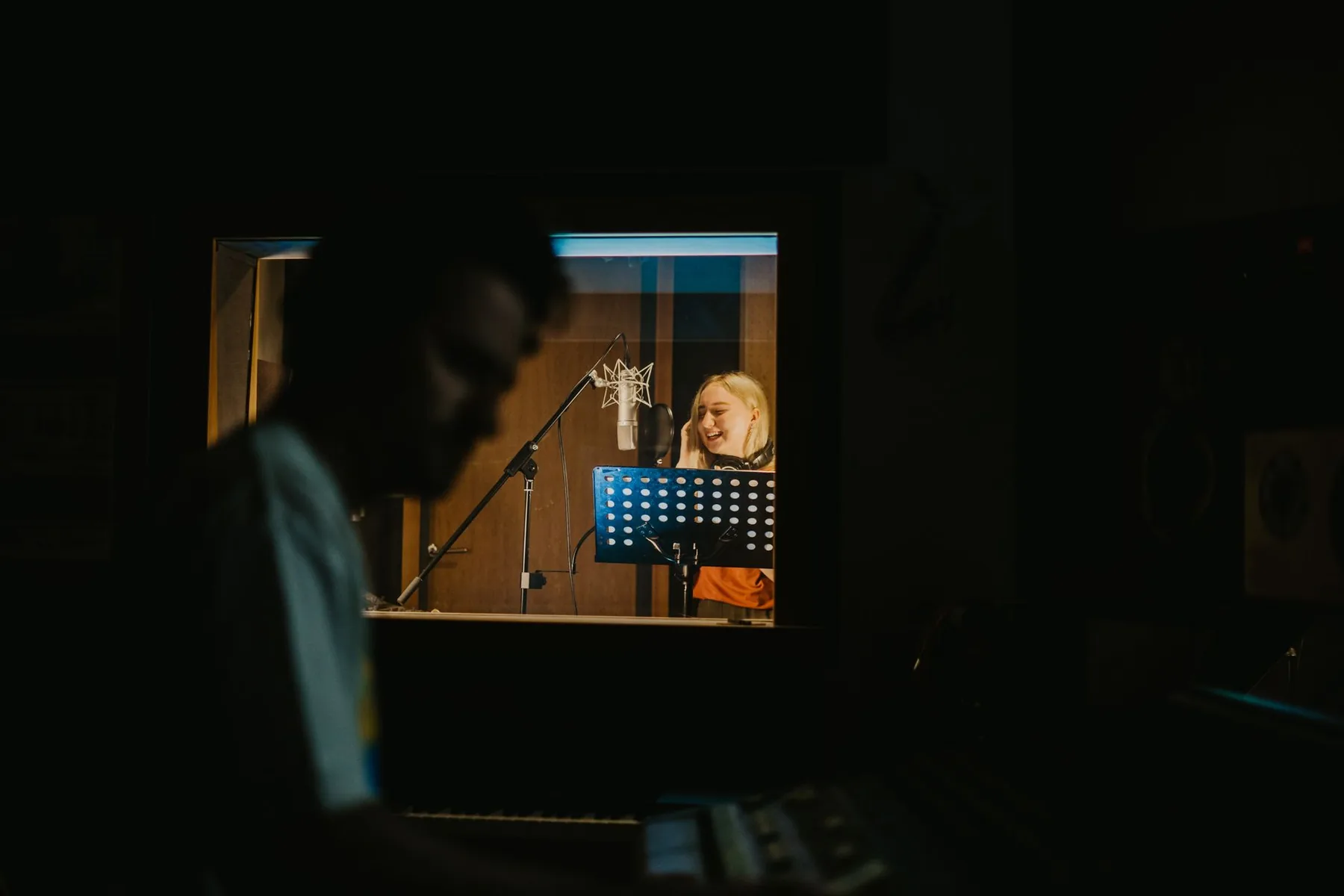 Singer in a studio with a microphone Singer in a studio with a microphone