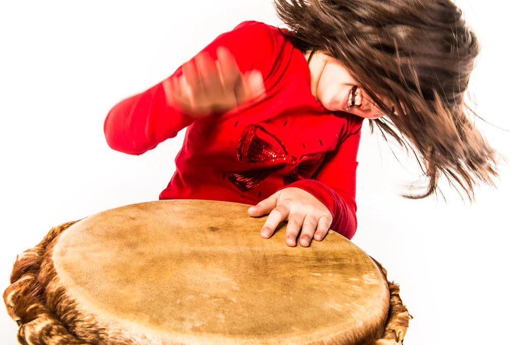 Young musician playing a drum