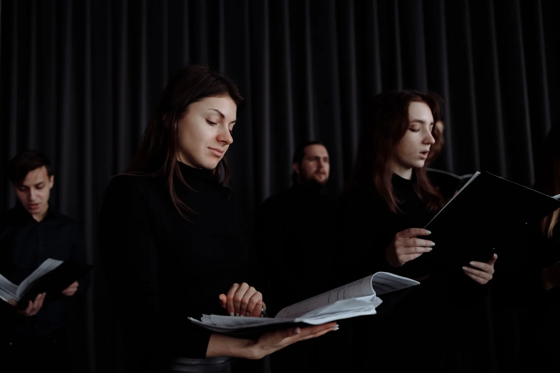Choir with sheet music in rehearsal