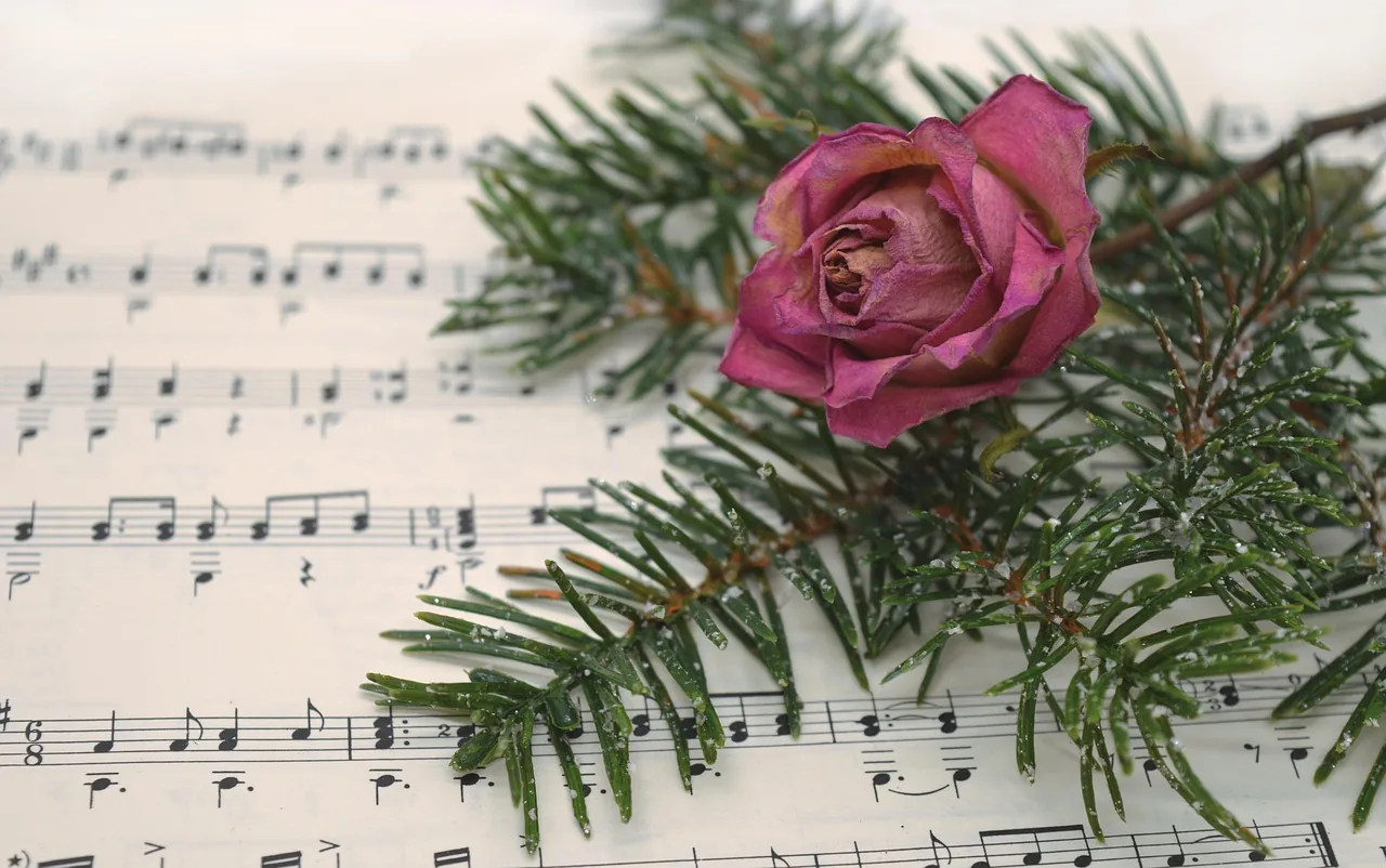 Christmas sheet music with a rose