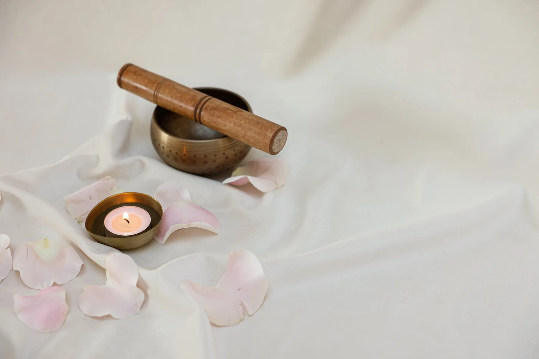 Tibetan bowl with mallet and candle