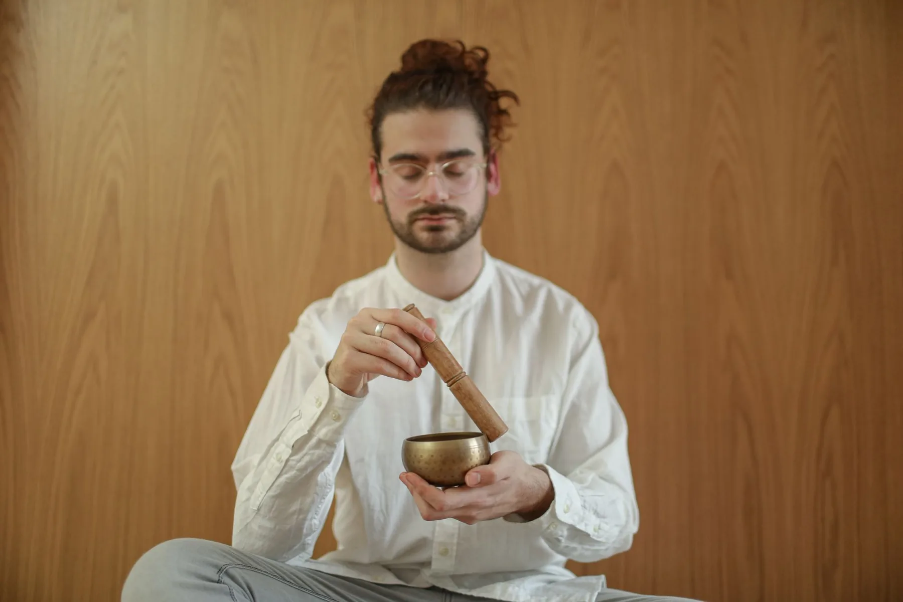 Tibetan singing bowl in a meditative session Tibetan singing bowl in a meditative session